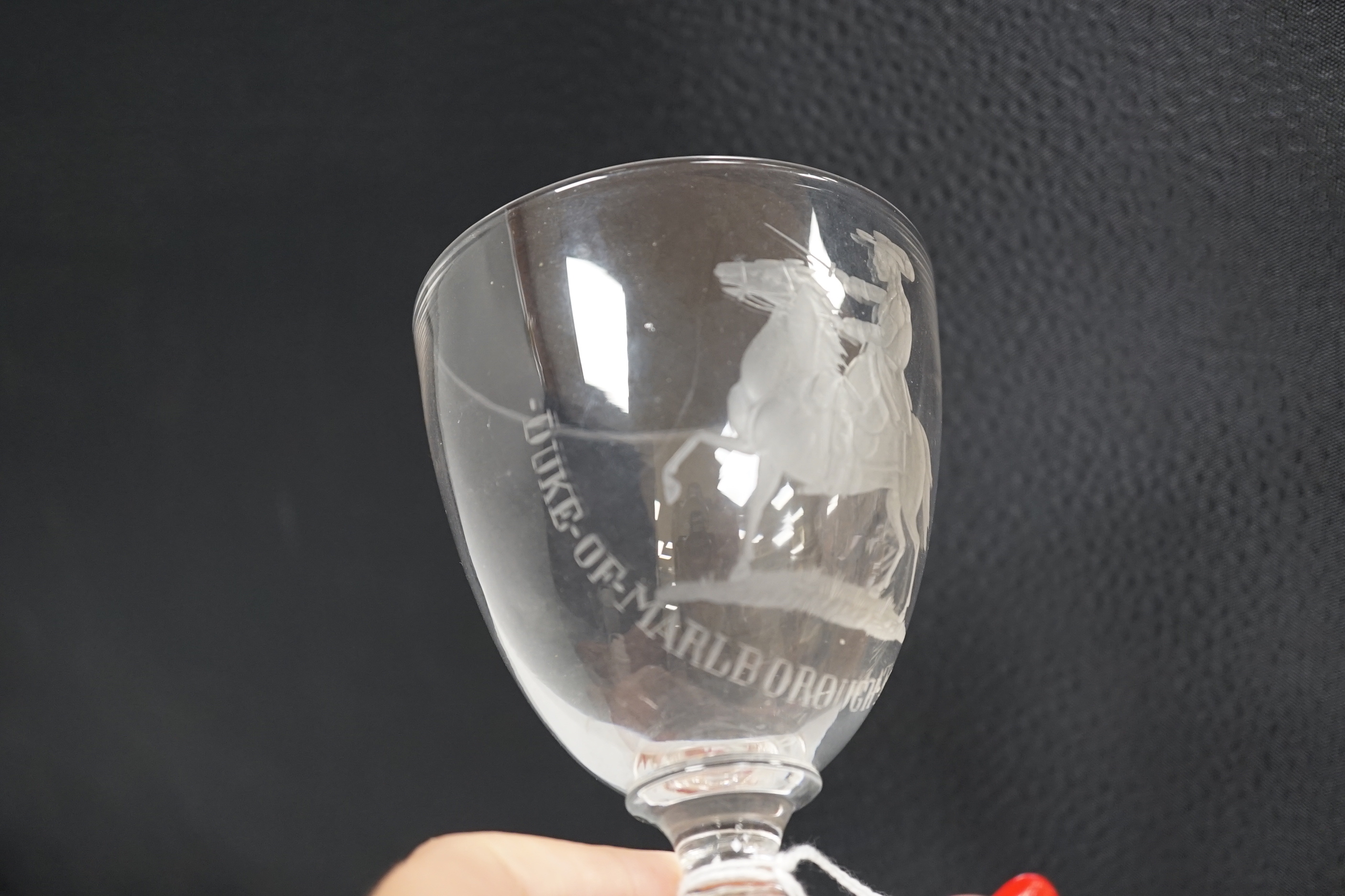 A glass goblet, engraved with the Duke of Marlborough at Ramillies, the goblet is small with a capstan stem and square moulded base with star cut base, likely to be a centenary or bi-centenary goblet of the 1706 battle.